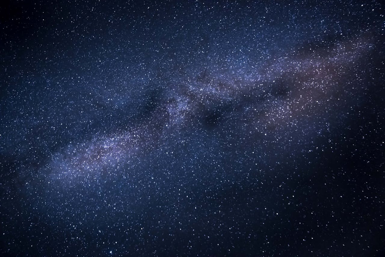 About A breathtaking image capturing the Milky Way galaxy against a dark, starry night sky.